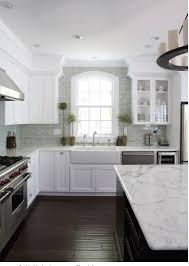 Sebring design build for more modern kitchen designs, choosing two contrasting tones can create a striking color scheme.this kitchen features bright white cabinets with a dramatic charcoal grey stacked stone backsplash. Gorgeous Kitchen Kitchen Design White Kitchen Design Kitchen Inspirations