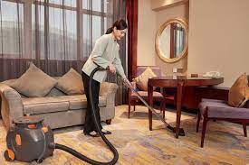 hotel service staff use vacuum cleaner