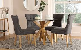 Our small dining sets feature space saving oak dining tables in a choice of shapes and designs including round, square and rectangular in natural and dark finishes paired with complementary dining chairs in a vast range of chic designs. Hatton Round Oak And Glass Dining Table With 4 Bewley Slate Fabric Chairs Furniture And Choice