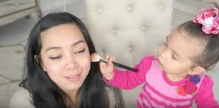 a 2 year old baby does her mum s makeup