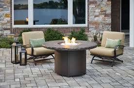 Round stone propane fire pit table with storage cover Marbleized Noche Beacon Round Gas Fire Pit Table The Outdoor Greatroom Company