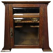 antique oak smokers cabinet art