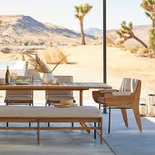 The dining chair is a stylish and low profile. Kinney Teak Outdoor Dining Table Bench Chair And Armchair Crate And Barrel
