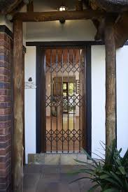 Just as perfection calls for an equally appropriate mode of protection, these top 40 best wooden gate ideas are is destined to secure your home and likewise leave an unforgettable signature: Security Gate Designs To Improve Kerb Appeal Burglar Bars
