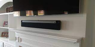 Tv And Sonos Playbar Mounted Over Fireplace