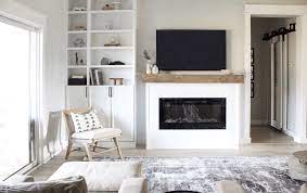 Use a circular saw to cut a mantel shelf to sit atop the two columns. Diy Modern Fireplace Designed Simple