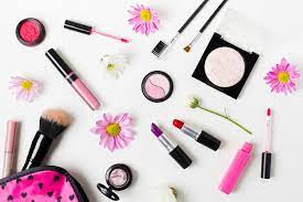 feminine colourful cosmetics on white desk