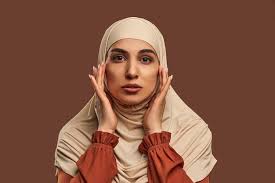 natural makeup dressed in beige hijab