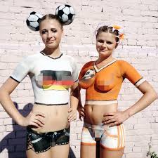 Body painting by lynn schockmel. A Germany Fan And Netherlands Fan Show Off Their Body Paint Prior To The Uefa Euro 2012 Group B Match Between Netherlands And Germany At Metalist Stadium In Kharkov Ukraine