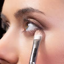 apply eyeshadow to make almond eyes pop
