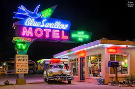 blue swallow motel neon light signage