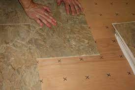 remove linoleum before laying tile
