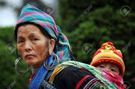 The hmong people are an ethnic group living mainly in southern china (guizhou, yunnan, sichuan, chongqing and guangxi), vietnam, laos, thailand, and myanmar. A Black Hmong Vietnamese Woman Carrying Her Child Sapa Vietnam Stock Photo Picture And Royalty Free Image Image 18799658