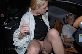 Britney Spears flashing her shaved pussy trying to get in the car.