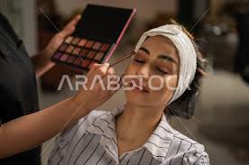makeup artist in a women s beauty salon