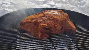 smoke pork shoulder on a charcoal grill
