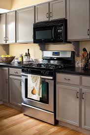 Your cabinets are lovely, i would not paint them but would add nice hardware in the finish of your choice and add some colorful art on walls. 19 Popular Kitchen Cabinet Colors With Long Lasting Appeal Better Homes Gardens
