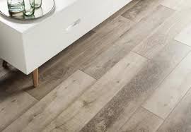 put vinyl flooring over wood or tile