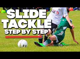 slide tackle in soccer football