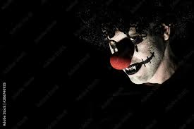 creepy clown with a red nose photos