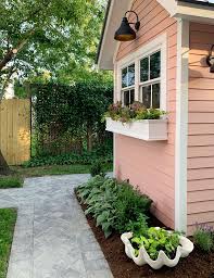 I would suggest painting the window box before it is hung to prevent the possibility of getting paint on the home or garden/potting shed. New Paint Lights Window Boxes For Our Backyard Shed Finally Young House Love