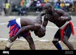 Uche Obieku left, from Anambra state fights with Joshua Preye of Bayelsa  state, right, fights in their 85 Kg bout in the traditional Nigerian  Wrestling ''Kokawa'' contest, during the 18th National Sports