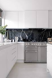 Navy minimalist cabinets plus a black marble backsplash and countertops that spruce up the whole space. 25 Refined Black Marble Home Decor Ideas Digsdigs