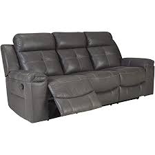 Mesa brown faux leather motion reclining sofa. Amazon Com Signature Design By Ashley Jesolo Casual Faux Leather Reclining Sofa Pull Tab Reclining Dark Gray Furniture Decor
