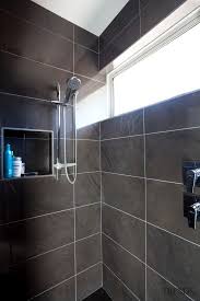Shower With Dark Grey Wall Tiles