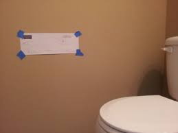 a toilet paper holder in a bathroom