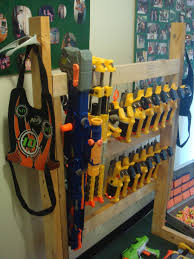This storage rack can hold up to 20 blasters of different sizes with shelves, drawers, rail mounts and hooks. Pin On Nerf Gun Storage