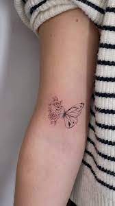 half erfly half flower tattoo