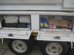 a truck camper on a flatbed trailer
