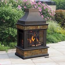 Add an outdoor fire pit that stands out from the rest with this black steel chiminea. Chimney Outdoor Fire Pit Fireplace Design Ideas