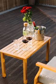 Wine Bottle On Wooden Table At Patio