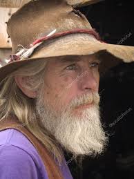 rugged cowboy stock photo by