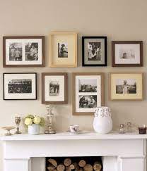 family photos above mantle wall