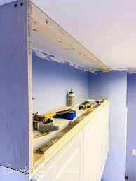 Locate the studs running through the rear and side walls surrounding the soffit area above the cabinets. How To Enclose The Open Space Above Cabinets Simply2moms