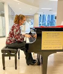 volunteer pianists play for peace of