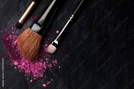 make up brushes with crushed cosmetics