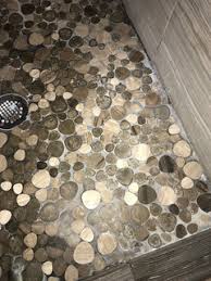 cleaning pebble rock shower basin