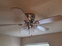 to balance a ceiling fan using a coin