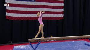 riley mccusker performs beam routine