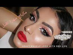 heavy arabic make up look with red lips