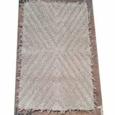 white rectangular cotton bath mat