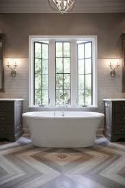 bathroom with herringbone tile floor