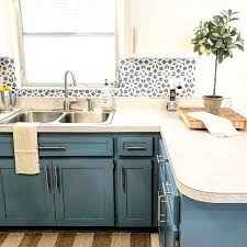 A backsplash of gray, black, and white oval mosaic tiles launched the design for this kitchen redo. Pin On Home Kitchen