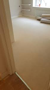 beige carpet to stairs and rooms