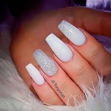 white nails with glitter ring finger