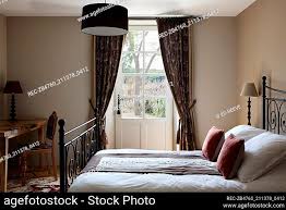 bed matching curtain stock photos and